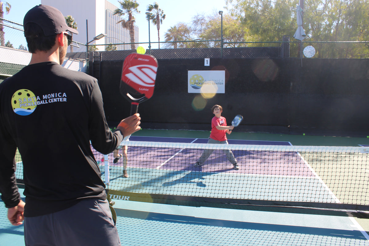 kids playing pickleball 