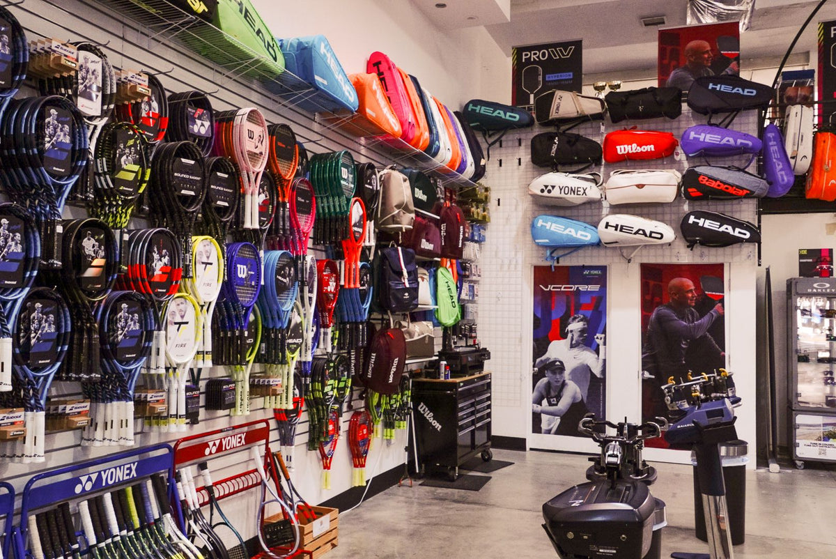 Tennis pro shop with racquets, bags and stringing machines