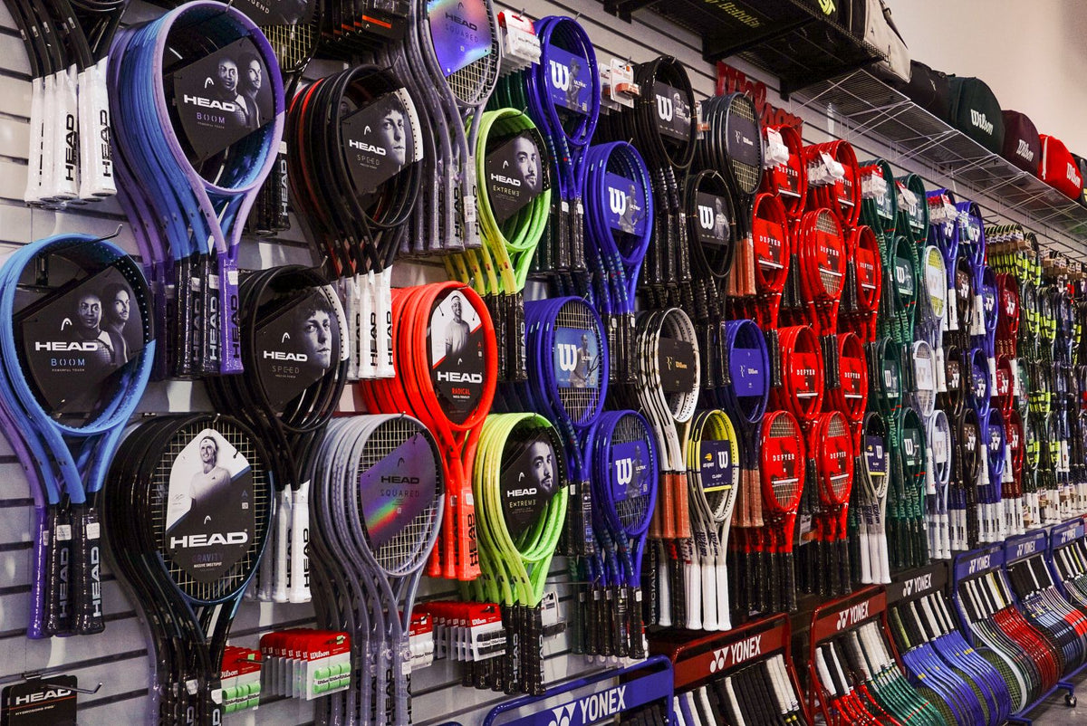 Wall of HEAD, Wilson and Yonex tennis racquets at Santa Monica Tennis Center